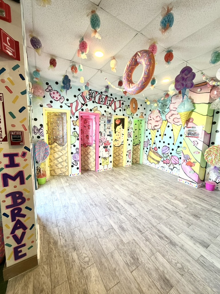 Bright candy-themed lobby inside Swimming Fishies